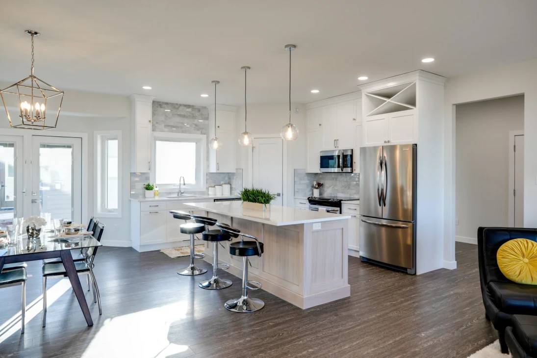A spacious kitchen and dining area featuring a large central island, perfect for cooking and gathering.