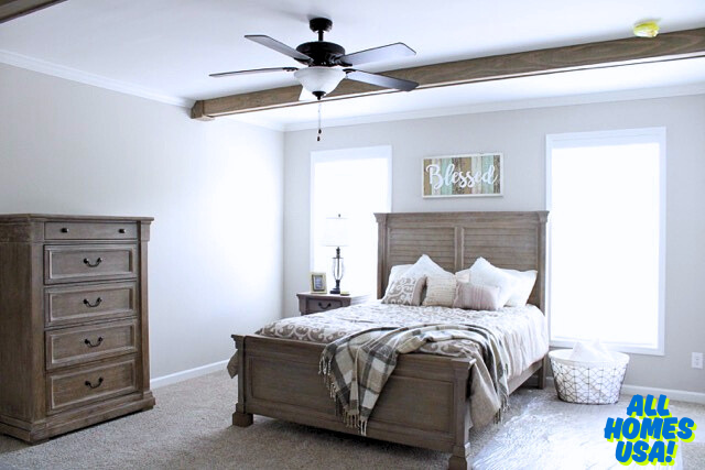 Cozy bedroom with a wooden bed, plaid blanket, and pillows. Dresser and lamp on the left, "Blessed" sign above. Neutral tones, serene vibe. Image for illustrative purposes.