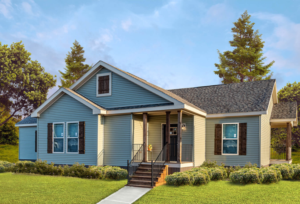 Single-story blue house with dark shutters, a small porch, and stairs. Surrounded by green grass and trees under a clear blue sky, conveying tranquility.