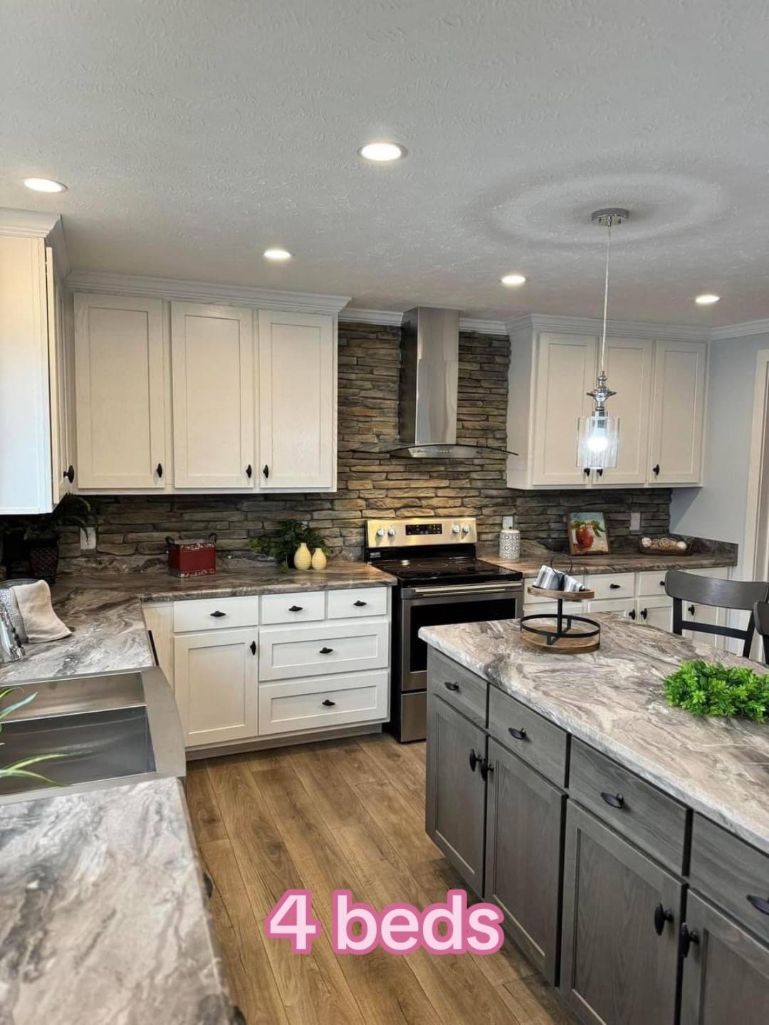 Modern kitchen with stone backsplash, stainless steel appliances, and white cabinets. Marble countertops and a central island create a cozy, inviting atmosphere. "4 beds" text overlayed in pink.