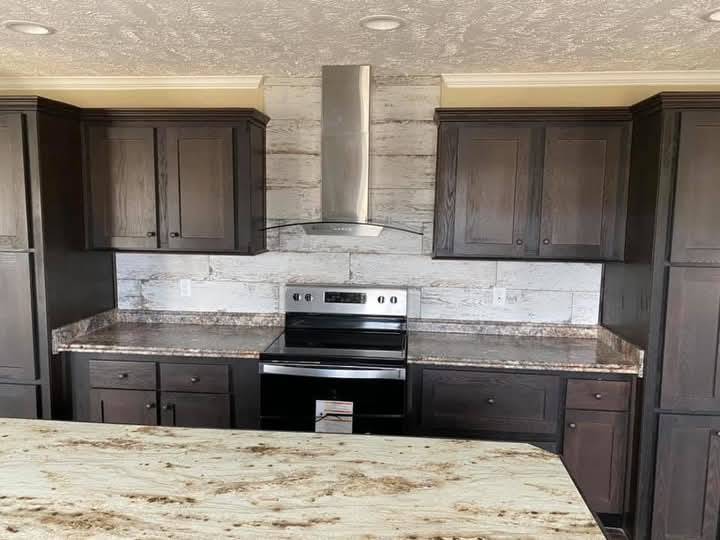 Modern kitchen with dark wooden cabinets, marble countertops, and a stainless steel stove with range hood. Bright, clean, and elegant ambiance.