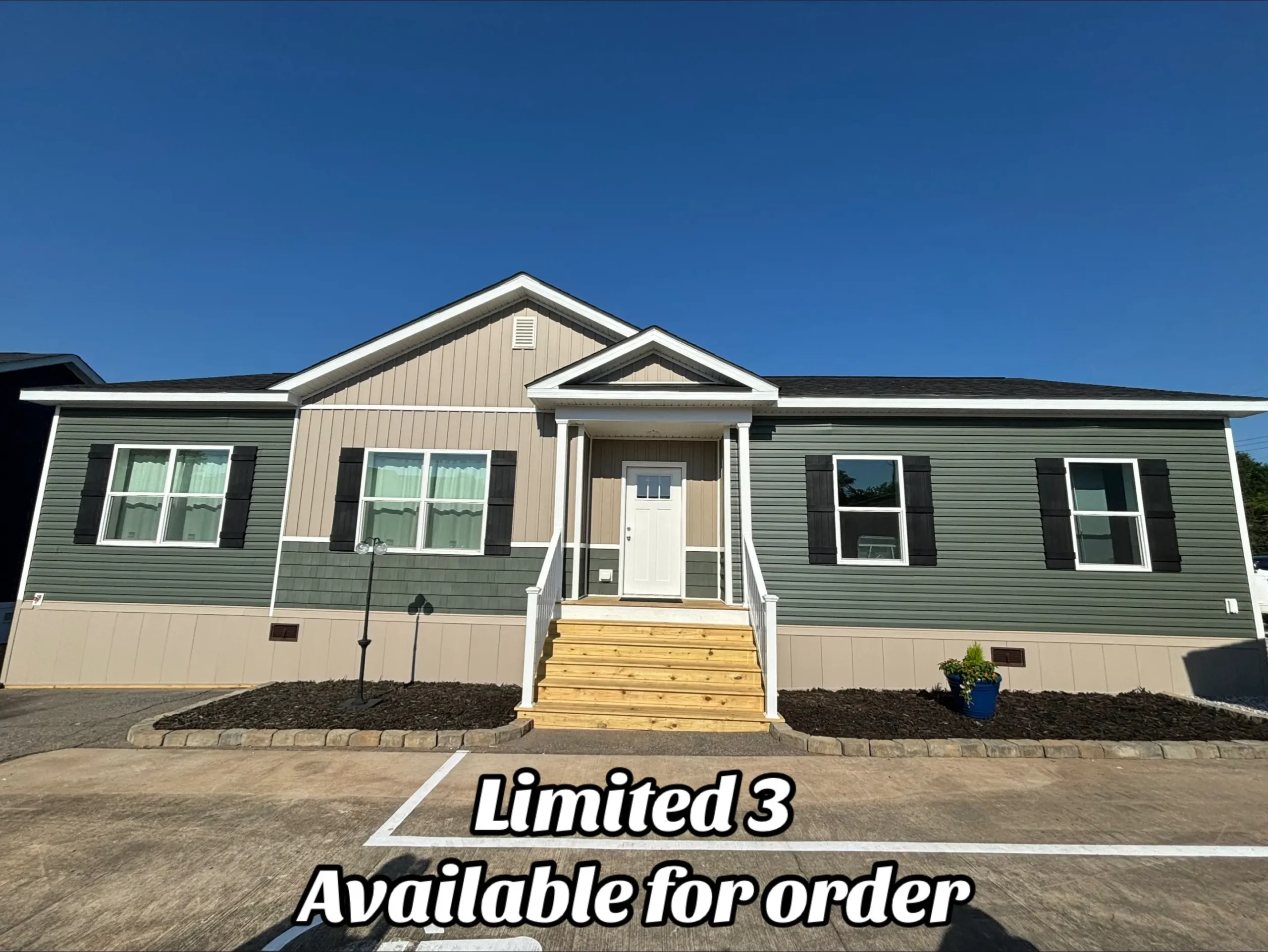 Single-story, green and beige manufactured home with a gabled roof, white trim, and front steps. Text overlay reads "Limited 3 Available for order." Clear blue sky.