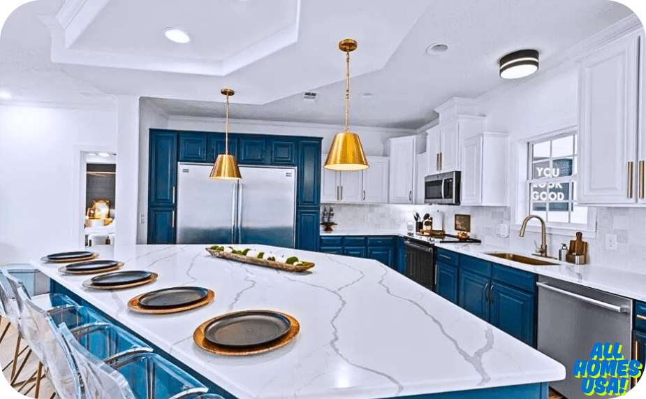 Modern kitchen featuring blue cabinets, a marble island, gold pendant lights, and stylish decor with a "YOU LOOK GOOD" sign. Image for illustrative purpose.