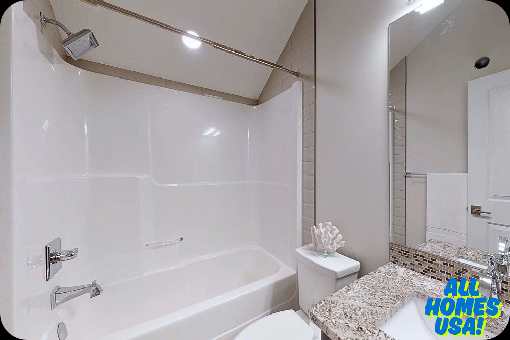 A modern bathroom with a sleek white bathtub and shower, featuring a granite countertop. A beige tile wall and white coral decoration add elegance. Image for illustrative purpose.