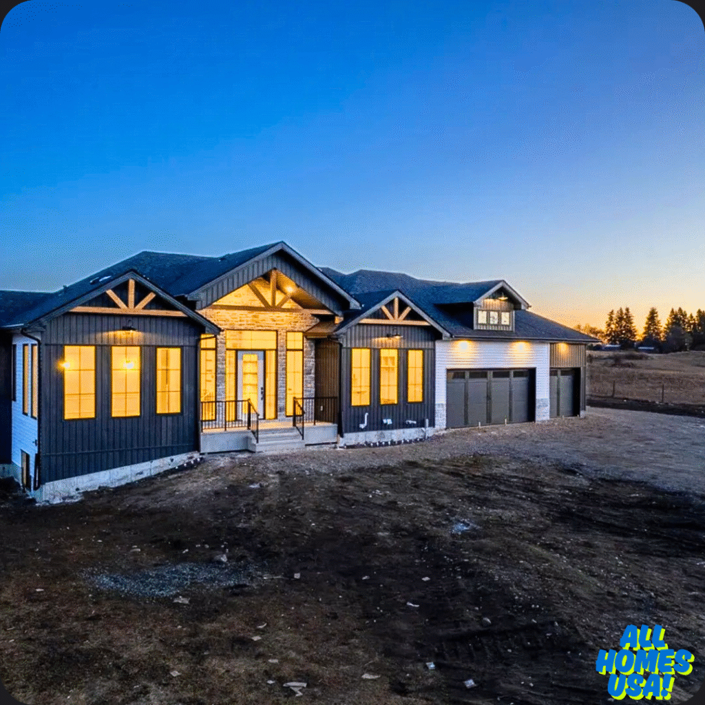 Modern single-story house with glowing windows at twilight, surrounded by open land. A vast evening sky creates a serene, inviting atmosphere. Image for illustrative purpose.