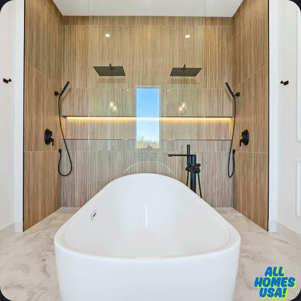 Modern bathroom with a white freestanding tub, dual rainfall showerheads, and wood-paneled walls. Natural light filters through a tall, narrow window. Image for illustrative purpose.