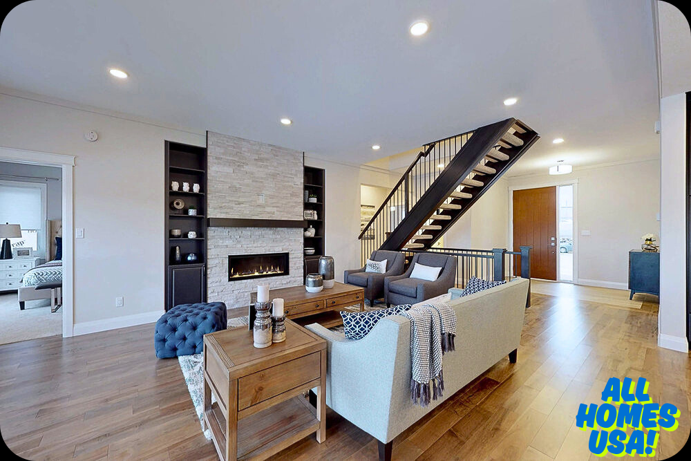 A modern living room with hardwood floors, a sleek stone fireplace, and a contemporary staircase. Neutral-toned furniture includes a sofa, chairs, and a wood coffee table, creating a cozy, sophisticated atmosphere. Image for illustrative purpose.