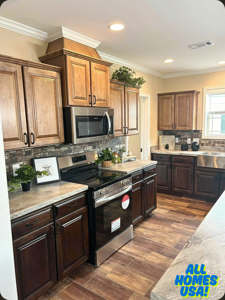 Warm, inviting kitchen with wooden cabinets, modern stainless steel appliances, and decorative greenery. The logo "All Homes USA!" is in the bottom right. Image for illustrative purpose.