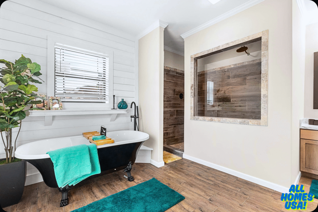 Modern bathroom featuring a black clawfoot tub with green towels and accessories. Wood accent walls, potted plant, and a walk-in shower add elegance. Image for illustrative purpose.